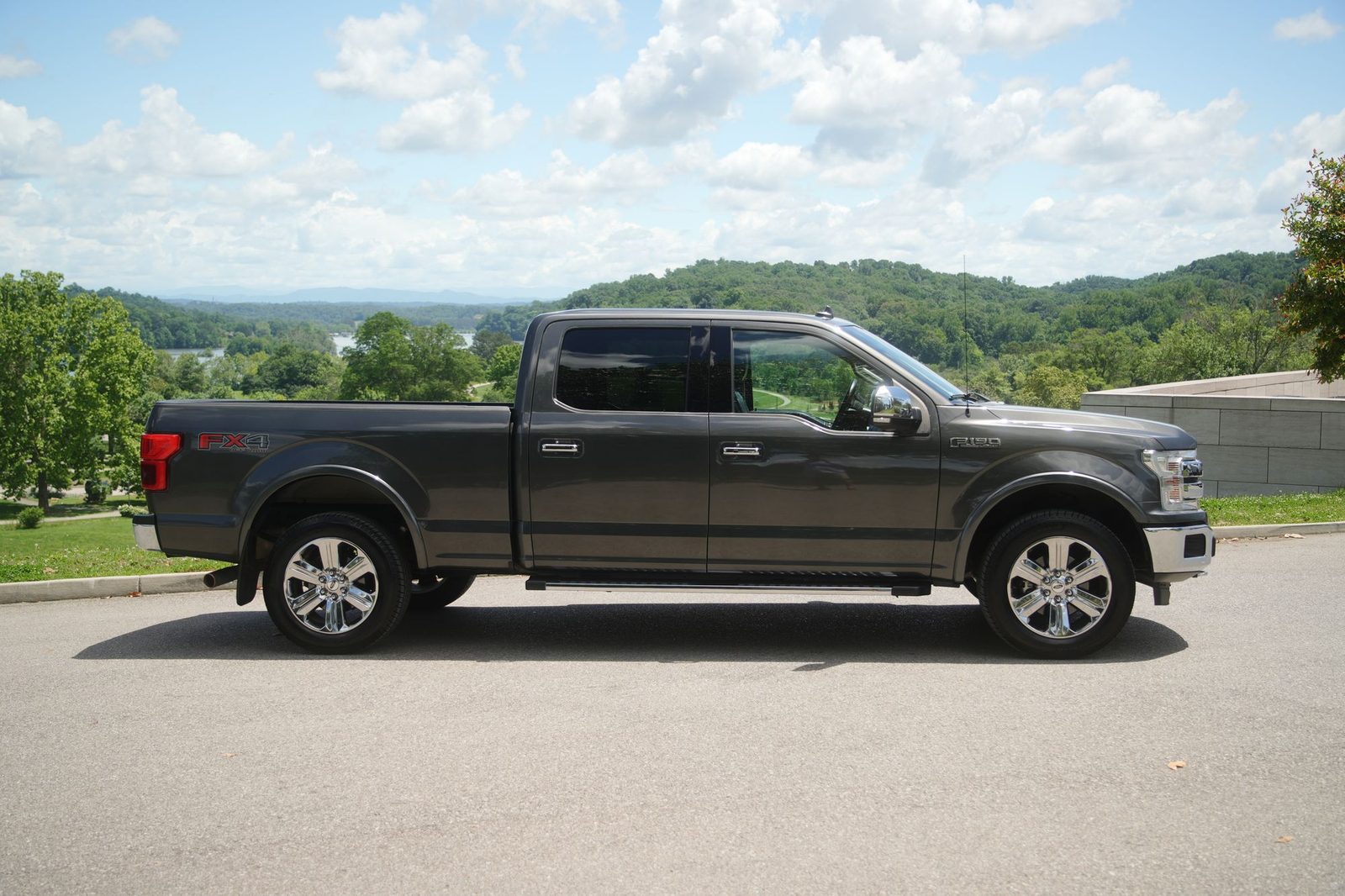 Ford pickup truck with Midwestern hills and river — auto coverage for Kentucky, Indiana, and Ohio drivers