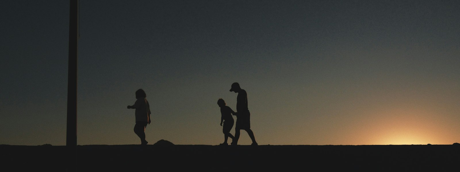 Family silhouette at sunset